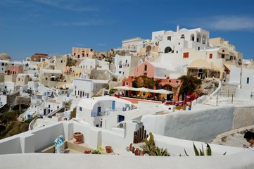 Fototapeta premium Santorini - the volcano among the Cyclades, Aegean sea. Island's capital, Fira, which is situated on the edge of a cliff. Known for distinctive architecture in white and blue colours