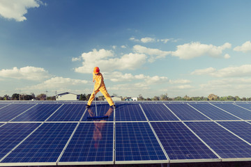 Technicians are cleaning solar panel.