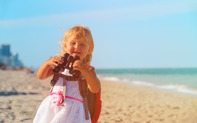 little girl travel on beach