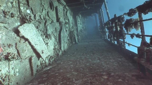Deck of sunken ship Salem Express shipwrecks underwater in the Red Sea in Egypt. Extreme tourism on ocean floor in world of coral reefs, fish, sharks. Researchers of wildlife blue abyss. Deep diving.