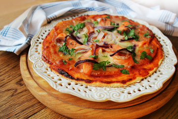 Pizza with mozzarella cheese , salmon, onion