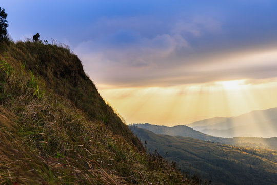 Beautiful Sunlight Rays on mountain with Landscape Photographer.