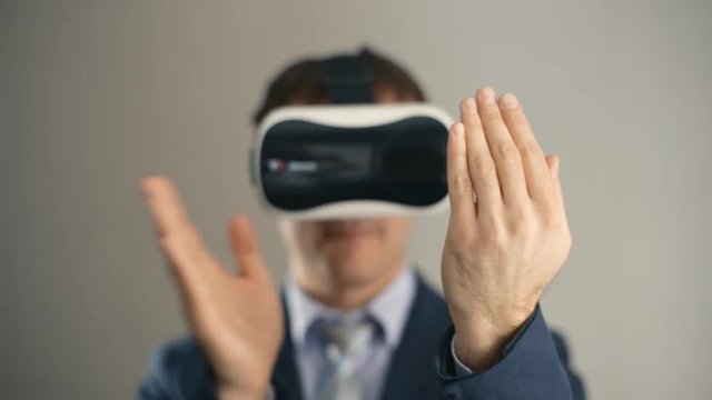 business man wearing virtual reality googles