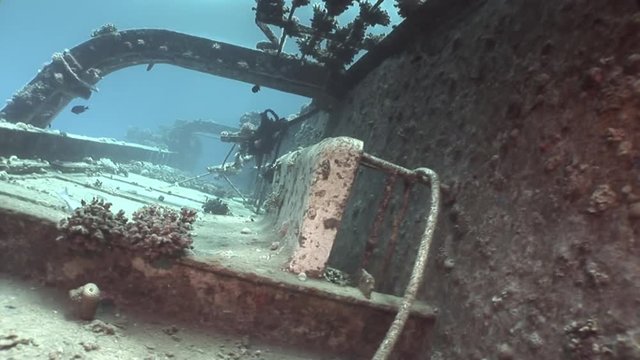 Bort of ship Salem Express on seabed wrecks underwater in Egypt. Extreme tourism on ocean floor in world of coral reefs, fish, sharks. Researchers of wildlife blue abyss. Deep diving.