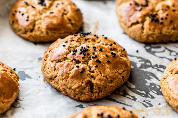 Homemade Turkish Pogaca Pastry with cumin seeds in a tray..