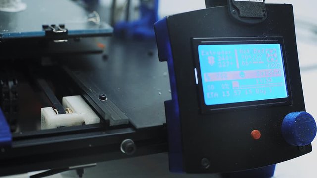 Close view on working control panel and screen of three dimensional printer