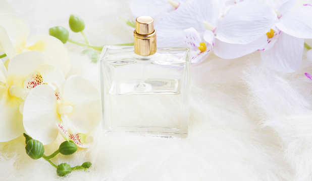 Perfume bottle with orchid flowers