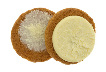 Top view of a cheesecake filled pumpkin cookie opened to show both halves isolated on a white background.