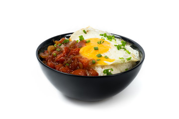 Rice with fried egg and tomato sauce isolated white background
