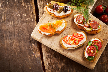 Serving of different canapes or antipasto