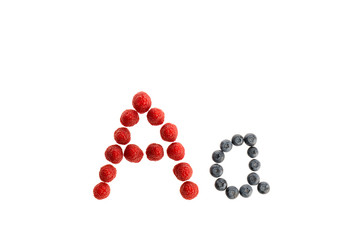 Alphabet from fresh fruit, raspberry and blackberry