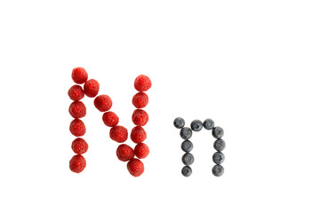 Alphabet from fresh fruit, raspberry and blackberry