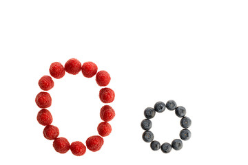 Alphabet from fresh fruit, raspberry and blackberry