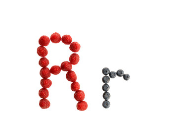 Alphabet from fresh fruit, raspberry and blackberry