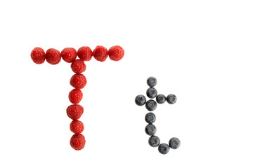 Alphabet from fresh fruit, raspberry and blackberry