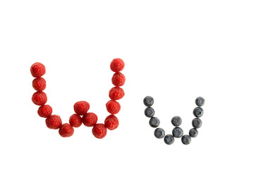 Alphabet from fresh fruit, raspberry and blackberry
