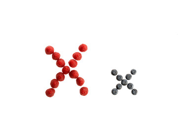 Alphabet from fresh fruit, raspberry and blackberry