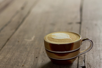 Coffee cup on the table, latte art