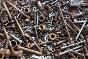 Old rusted and oiled screws background.
