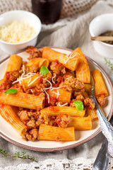 Pasta rigatoni in bolognese sauce with ground meat