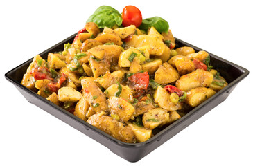 Potato salad Mediterranean with sun dried tomatoes. Isolated.