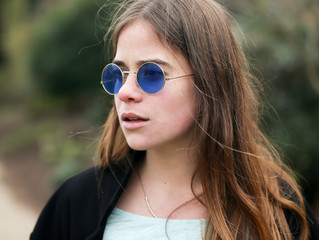 White Caucasion Beautiful Young Brunette Woman Portrait Outdoors Brown Hair And Round Glasses 