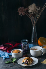 Fototapeta na wymiar spring breakfast with muffins in rustic style