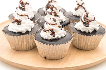 chocolate cup cake with whipped cream