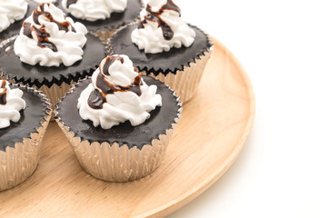 chocolate cup cake with whipped cream