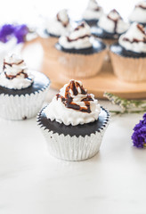 chocolate cup cake with whipped cream