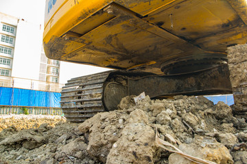 Fototapeta premium yellow backhoe loader on construction site and work