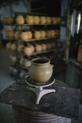 man that works in the factory of pottery