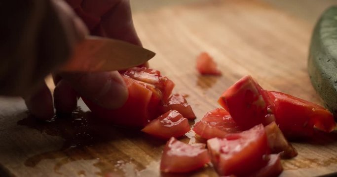 Tomato slicing slowmotion close up