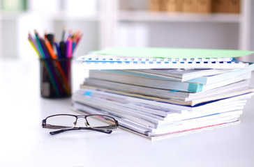 Group of multicolored office folders and glasses