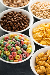 Variety of cold cereals in white bowls