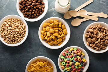 Variety of cold cereals in white bowls