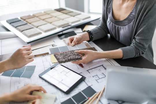 An interior designer consults with clients