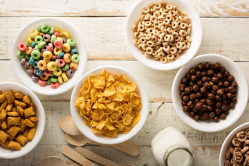 Variety of cold cereals in white bowls