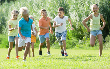 children running together in park .