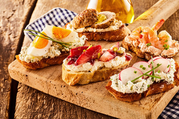 Assortment of tasty bruschetta appetizers