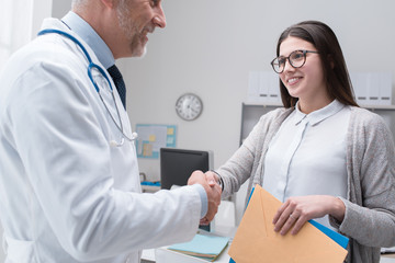 Doctor and patient shaking hands