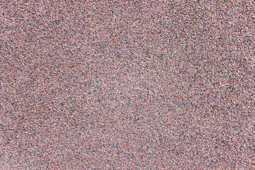 Texture of small, multi-colored crumbs of basalt, abstract background