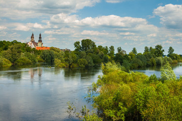 Warta River and Lad Abbey. Monastery in Lad (village), Poland. 