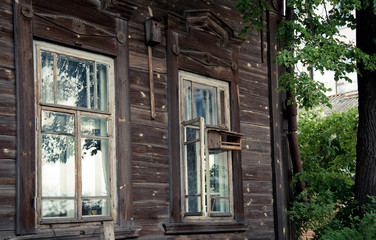 Fototapeta na wymiar Old window in a wooden house
