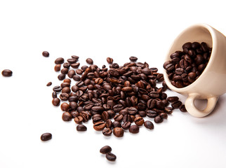 Coffee beans in coffee cup isolated on white