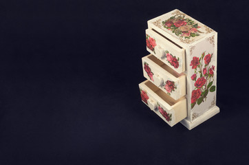 Decoupage handmade. White box in vintage style on a dark background.