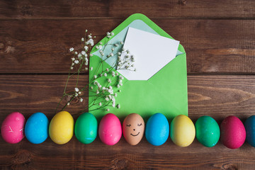 Easter eggs  on rustic wooden  background . Easter greeting card