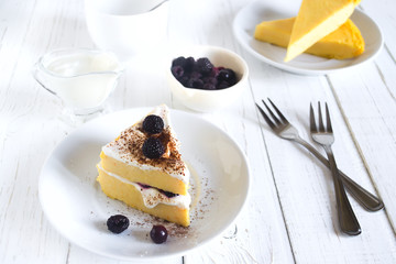 Cottage cheese baked pudding, sour cream and blueberries