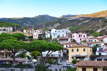 Obraz premium Small village with colourful houses on seaside of Elba island, Italy