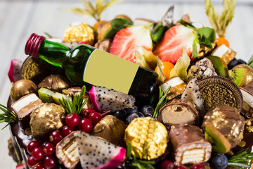Chocolate cupcakes and cake. Cupcakes with berries,fruit,strawberries.colorful cupcake,tasty cake,colorful cream,candies, wooden background,close up,dessert concept,Birthday cake with wine,rome